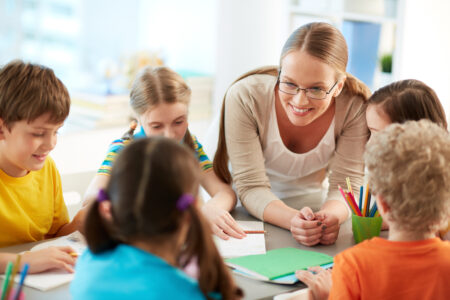 Portrait,Of,Diligent,Schoolkids,And,Their,Teacher,Talking,At,Lesson